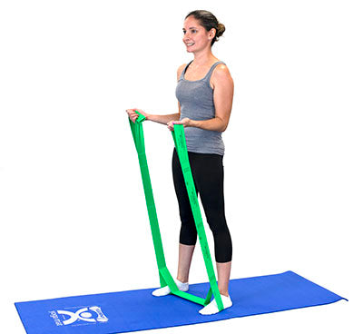A green Cando multi-exerciser in use by a female