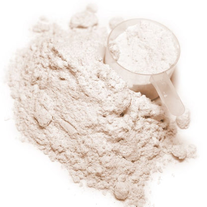 Beige powder with a white scoop on a white background