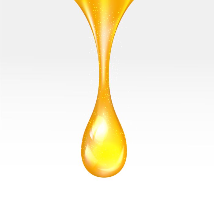 Yellow droplet on a white background