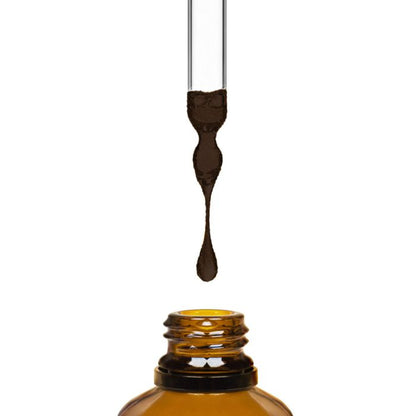 Amber glass dropper bottle with a droplet of liquid on a white background