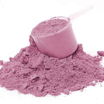 Pink sand with a scoop on a white background