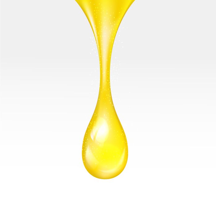 Yellow droplet on a white background