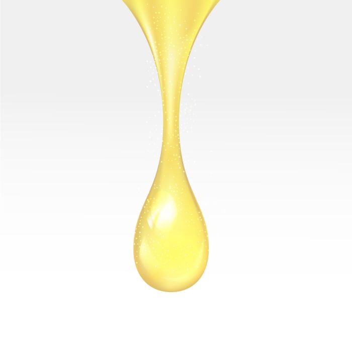 Yellow droplet on a white background