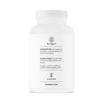 White supplement bottle with black text on a white background