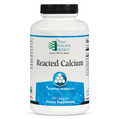 Supplement bottle labeled 'Reacted Calcium' by Ortho Molecular Products on a white background