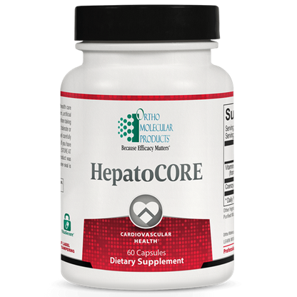 A bottle of Orthomolecular Products HepatoCORE dietary supplement, which appears to be white with a label that includes red and green accents and text indicating its function related to cardiovascular health.