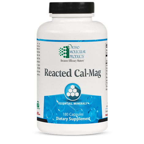 A bottle of OrthoMolecular Products Reacted Cal-Mag dietary supplement with 180 capsules, primarily white in color with blue and green labeling.