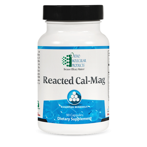 A bottle of OrthoMolecular Products Reacted Cal-Mag dietary supplement with 90 capsules, primarily white in color with blue and green labeling.