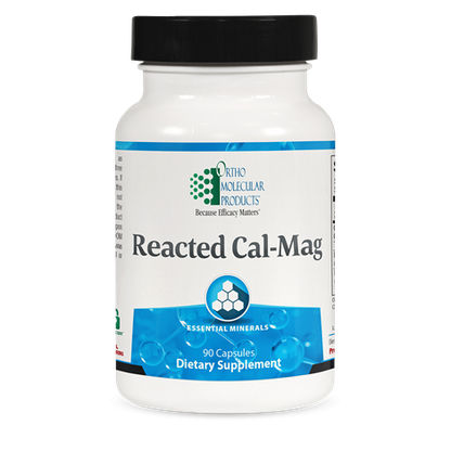 A bottle of OrthoMolecular Products Reacted Cal-Mag dietary supplement with 90 capsules, primarily white in color with blue and green labeling.