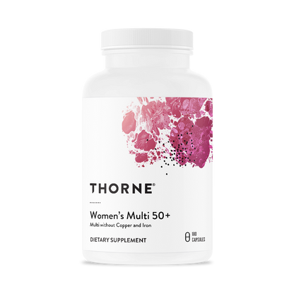 A bottle of Thorne Women's Multi 50+ dietary supplement with a white label and pink floral design.