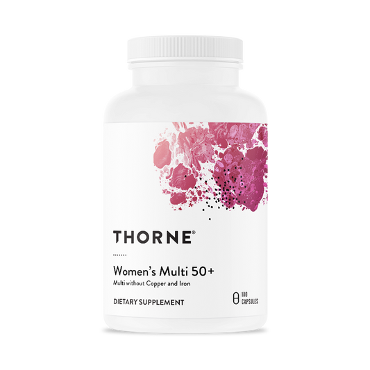 A bottle of Thorne Women's Multi 50+ dietary supplement with a white label and pink floral design.