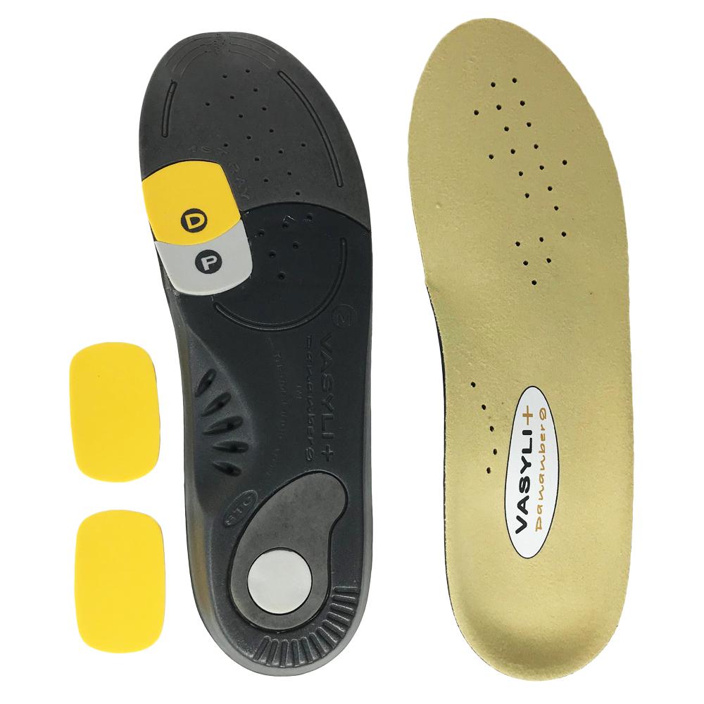 Vasyli+ branded shoe insoles with a black and beige design on a white background