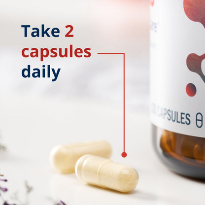 Two capsules and a bottle with text 'Take 2 capsules daily' on a light background