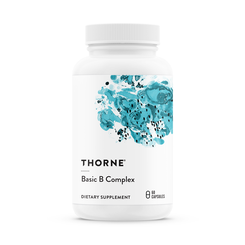 A bottle of Thorne Basic B Complex dietary supplement with a white label and blue watercolor design.