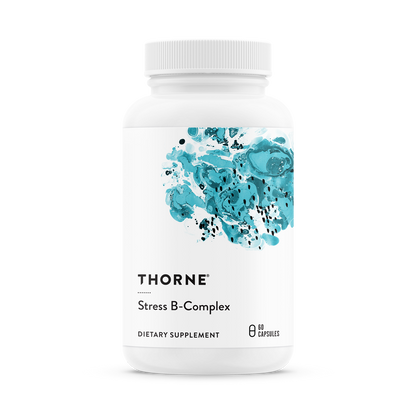 A bottle of Thorne Stress B-Complex dietary supplement with a white label and blue watercolor design.