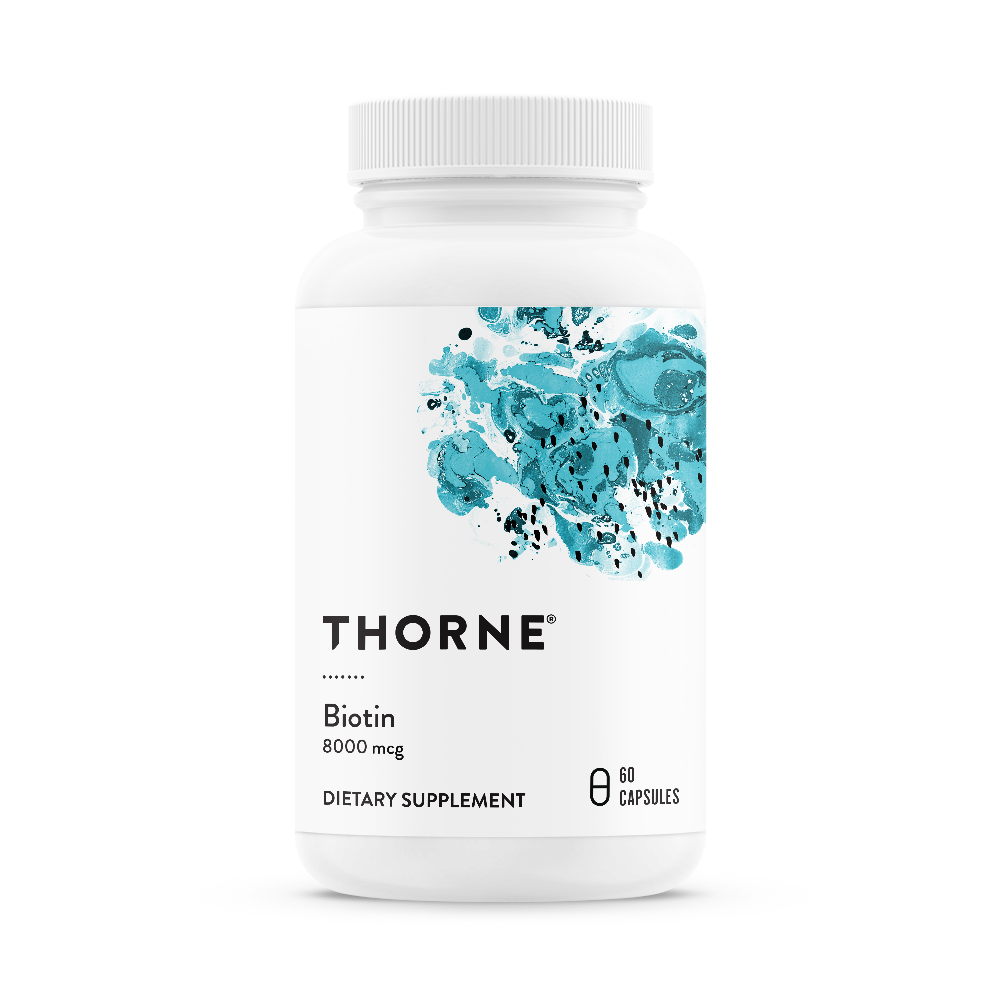 A bottle of Thorne Biotin dietary supplement with 8000 mg dosage, containing 60 capsules.