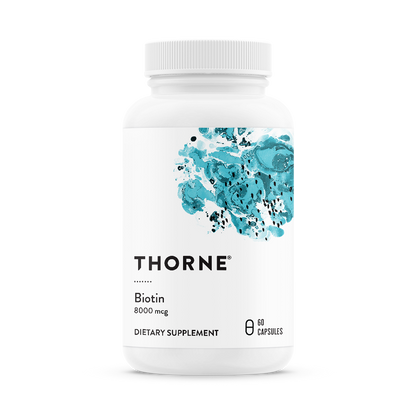 A bottle of Thorne Biotin dietary supplement with 8000 mg dosage, containing 60 capsules.