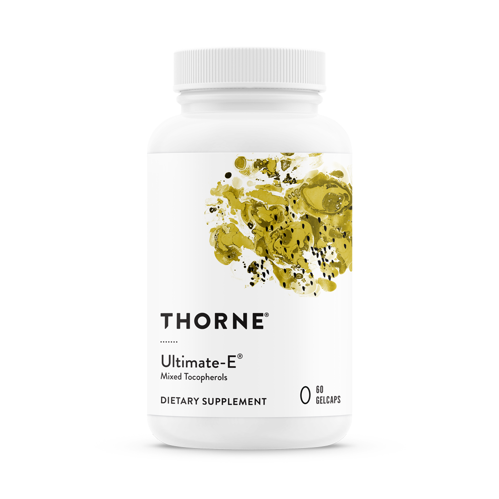A bottle of Thorne Ultimate-E mixed tocopherols dietary supplement with a white label and yellow accents.