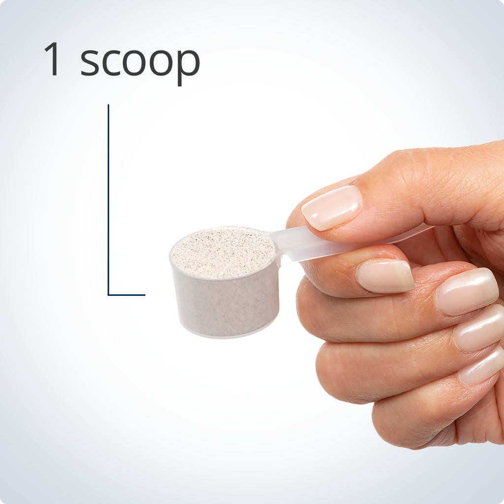 Hand holding a scoop with a powder, labeled '1 scoop', on a light gray background