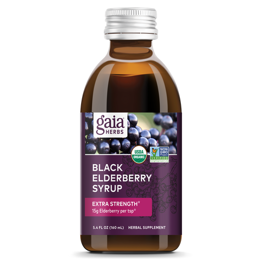 A bottle of Gaia Black Elderberry Syrup with a purple label, indicating extra strength and the equivalent of 15g of elderberries per serving.