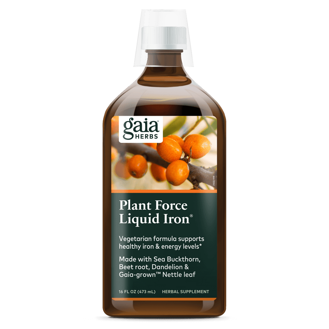 A bottle of Gaia Plant Force Liquid Iron supplement with a label showing the brand name, product name, and images of plants. The bottle is 16 oz in size.