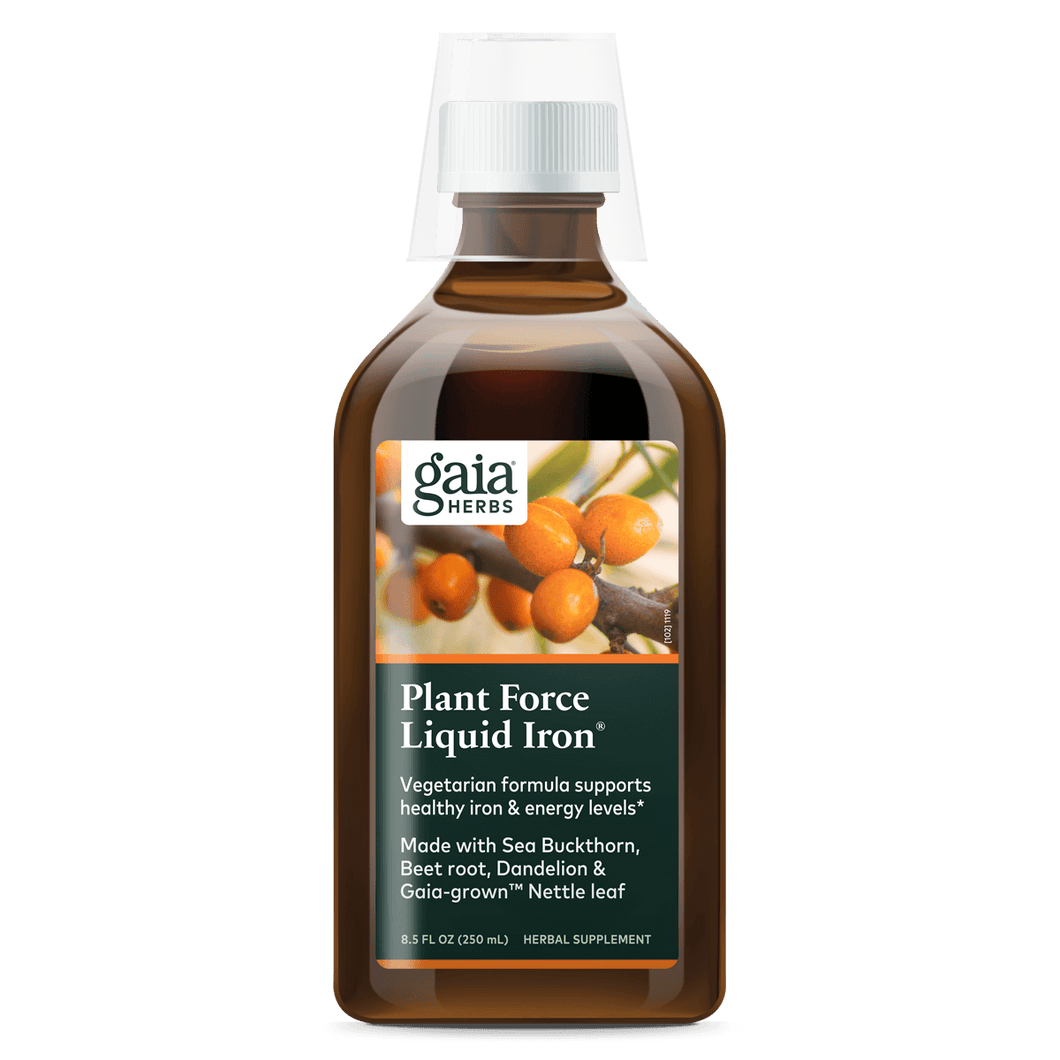 A bottle of Gaia Herbs Plant Force Liquid Iron supplement with a label showing the product name and an image of plants.