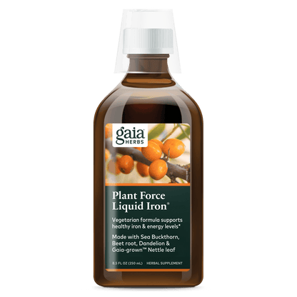 A bottle of Gaia Herbs Plant Force Liquid Iron supplement with a label showing the product name and an image of plants.
