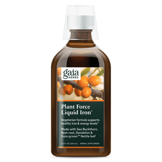 A bottle of Gaia Herbs Plant Force Liquid Iron supplement with a label showing the product name and an image of plants.