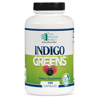 A bottle of Orthomolecular Products Indigo Greens Capsules with 180 capsules visible.