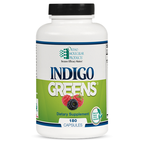 A bottle of Orthomolecular Products Indigo Greens Capsules with 180 capsules visible.
