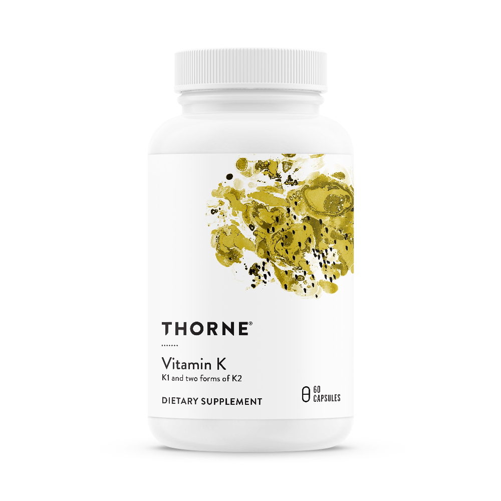 A bottle of Thorne Vitamin K dietary supplement with a white label and green and yellow accents.