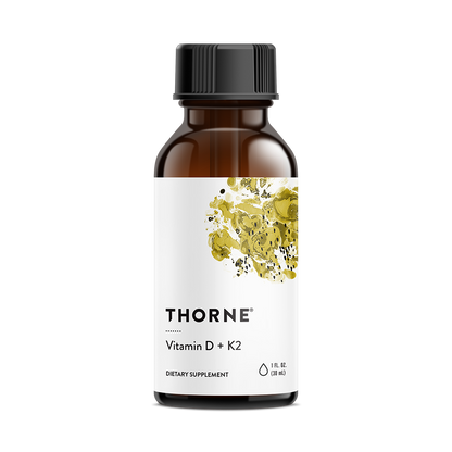 A bottle of Thorne Vitamin D + K2 Liquid supplement with a white label and yellow accents.