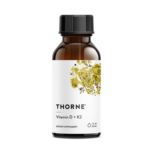 A bottle of Thorne Vitamin D + K2 Liquid supplement with a white label and yellow accents.