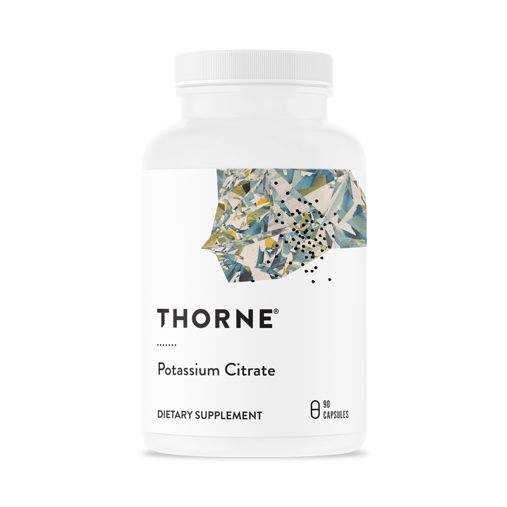 A bottle of Thorne Potassium Citrate dietary supplement with a white label and floral design.
