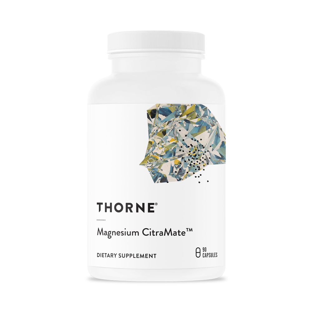 A bottle of Thorne Magnesium CitraMate dietary supplement with a label showing the brand and product name.