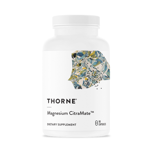 A bottle of Thorne Magnesium CitraMate dietary supplement with a label showing the brand and product name.