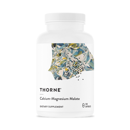 A bottle of Thorne Calcium-Magnesium Malate dietary supplement with a floral design on the label.