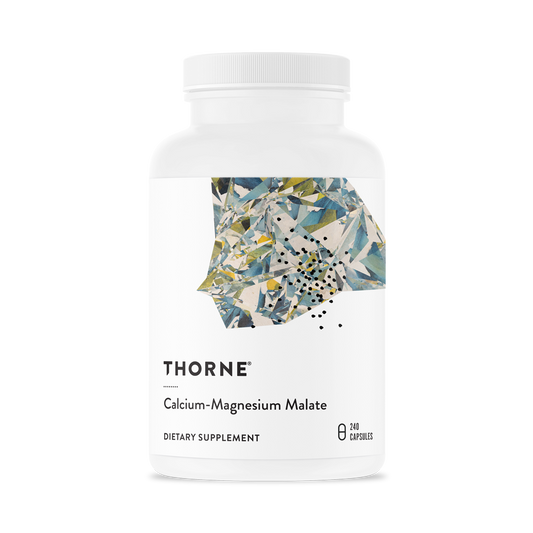 A bottle of Thorne Calcium-Magnesium Malate dietary supplement with a floral design on the label.