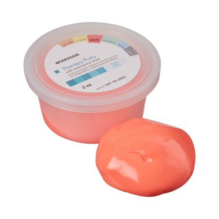 A color-coded McKesson Therapy Putty in orange, with the product information visible on the label.