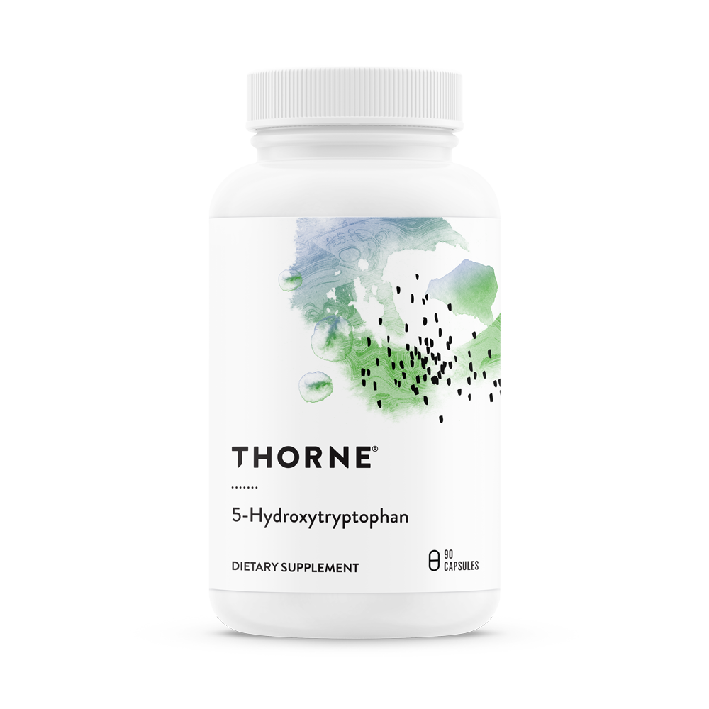 A bottle of Thorne 5-Hydroxytryptophan dietary supplement with a white label and green botanical designs.