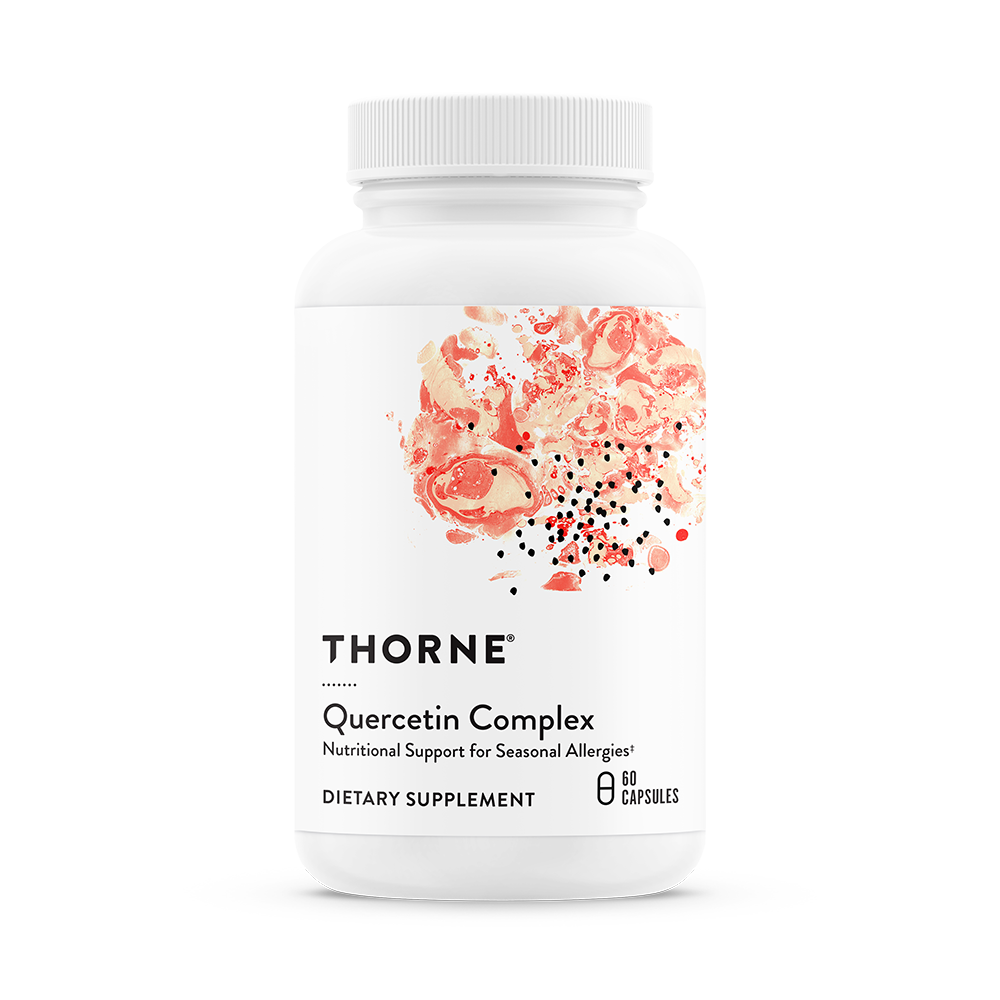 A bottle of Thorne Quercetin Complex dietary supplement with a white label and pink floral design.