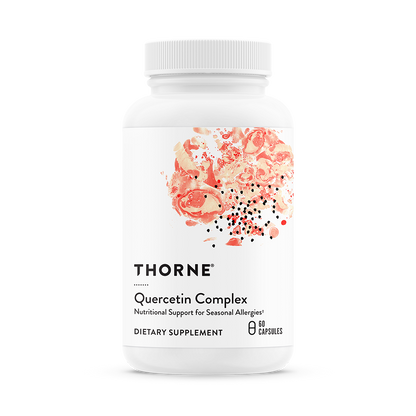 A bottle of Thorne Quercetin Complex dietary supplement with a white label and pink floral design.