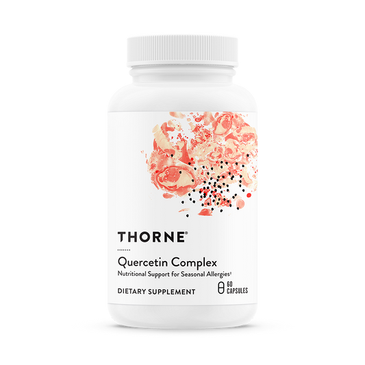 A bottle of Thorne Quercetin Complex dietary supplement with a white label and pink floral design.