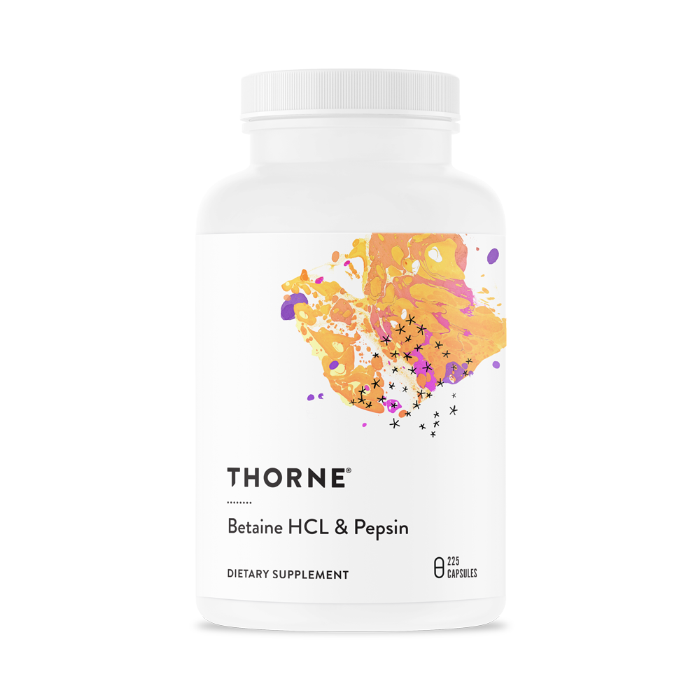 A bottle of Thorne Betaine HCL & Pepsin dietary supplement with a colorful design on the label.
