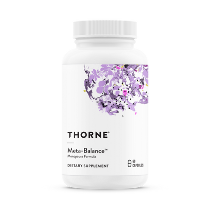 A bottle of Thorne Meta-Balance dietary supplement with a floral design on the label.