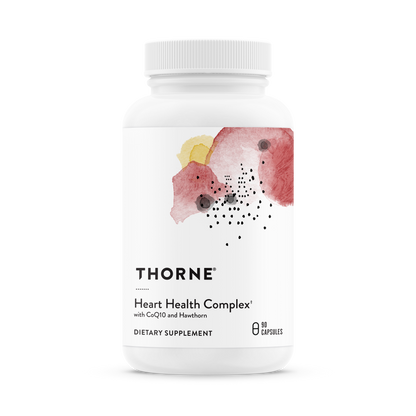 A bottle of Thorne Heart Health Complex dietary supplement with a floral design on the label.
