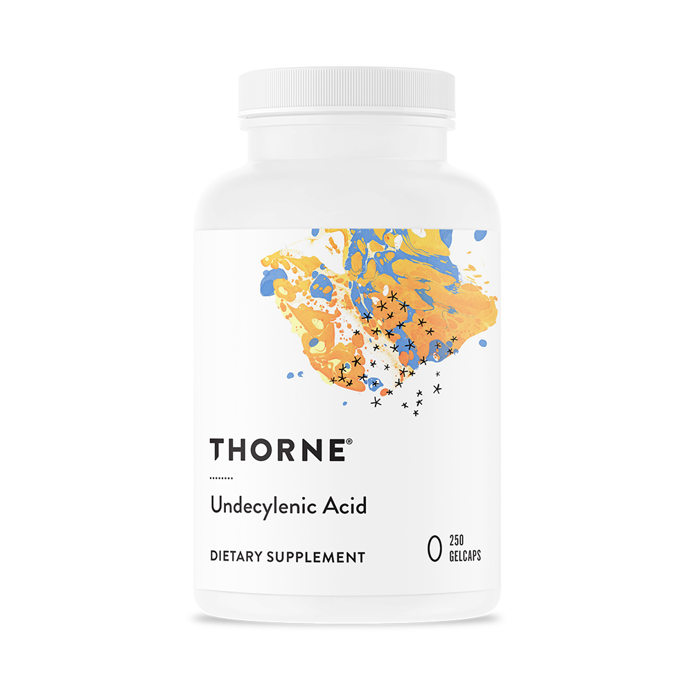 A bottle of Thorne Undecylenic Acid dietary supplement with a colorful abstract design on the label.