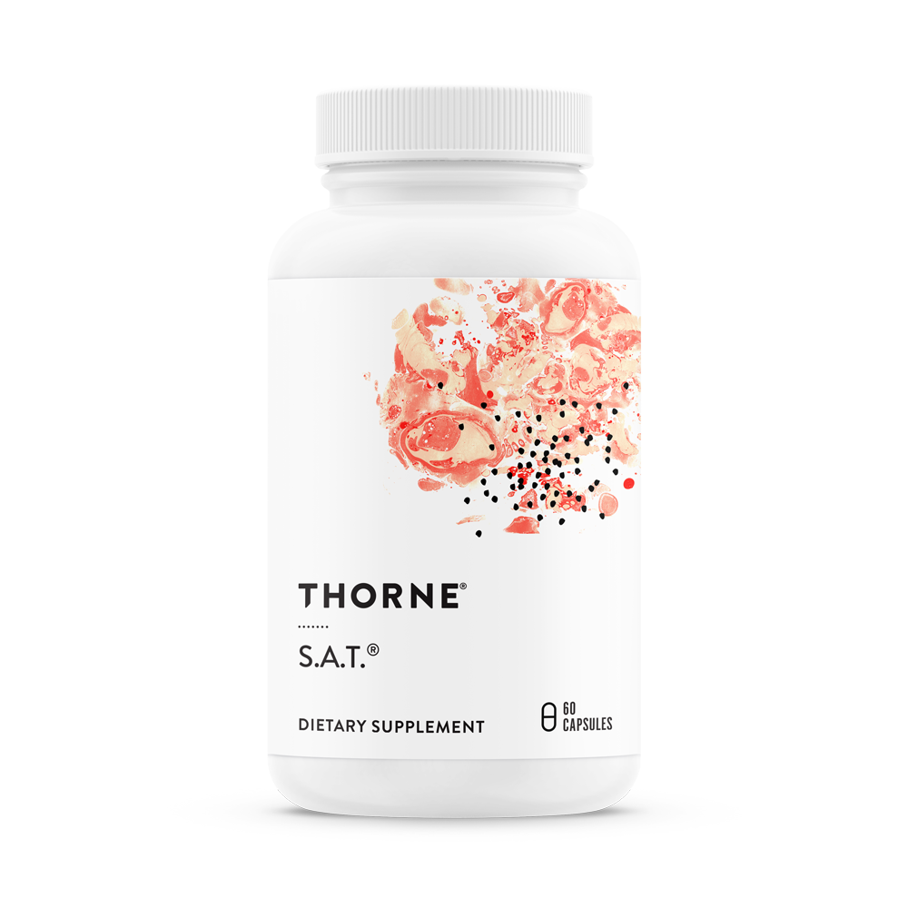 A bottle of Thorne S.A.T. dietary supplement with a floral design on the label.