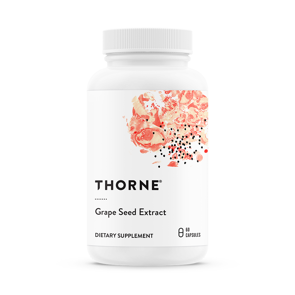A bottle of Thorne Grape Seed Extract dietary supplement with a graphic of red grapes on the label.