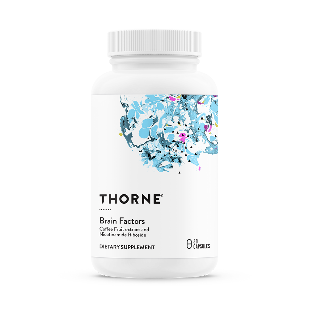 A bottle of Thorne Brain Factors dietary supplement with a floral design on the label.
